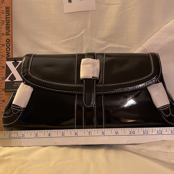Black brand new MAXX NEW YORK purse. Never used no rips, tears or damage. 14 x 7 - Picture 2 of 11